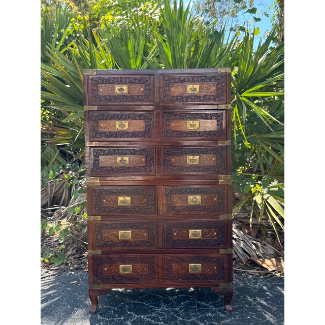 Striking pair of vintage Anglo-Indian style campaign chests crafted in richly toned rosewood, featuring beautifully carved...