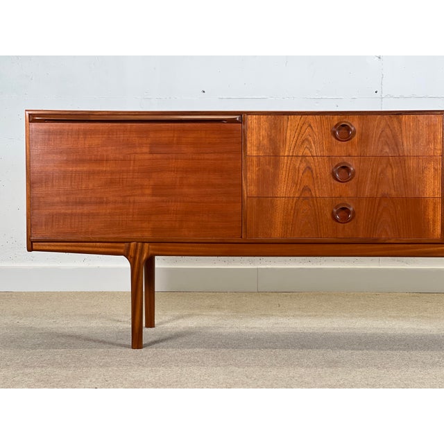 Stunning and unusual mid-century sideboard designed by Tom Robertson for cabinetmaker A.H. McIntosh in Scotland for the...