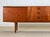 Stunning and unusual mid-century sideboard designed by Tom Robertson for cabinetmaker A.H. McIntosh in Scotland for the...