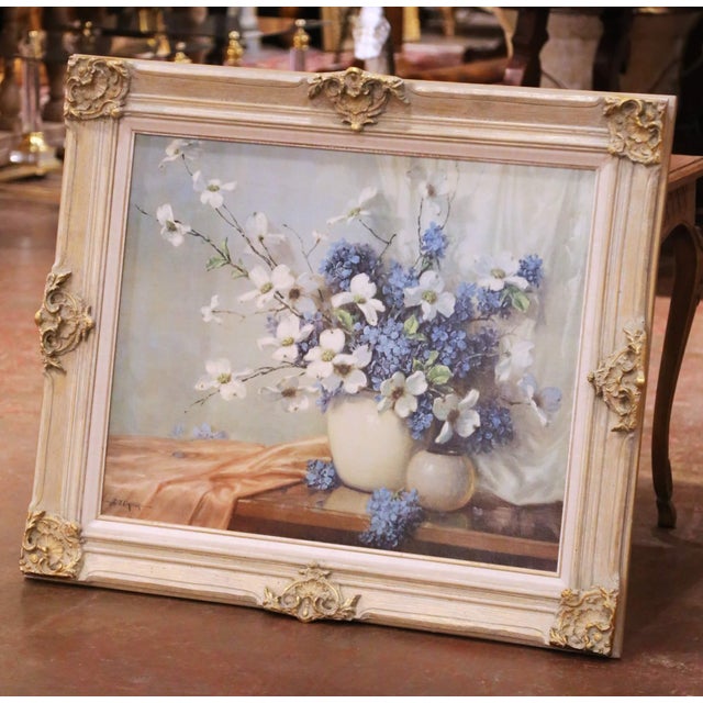 Decorate a wall with this elegant floral still life presented in a carved and painted frame with gilt accents. The...