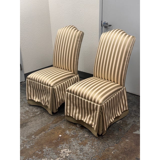 Design Plus Gallery presents a pair of Striped Upholstered Skirted Dining Chairs from Ethan Allen. Each chair has a high...
