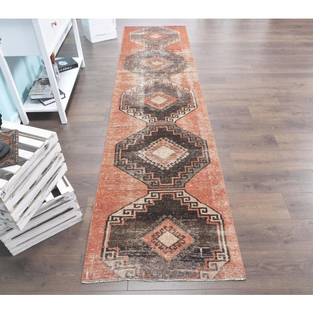 Vintage Turkish Hand-Knotted Herki Runner Rug is a semi-Vintage rug. '60s Eastern region of Turkey's unique rug is...