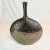 Vintage Home is pleased to offer this Faux Reptile Skin Ceramic Vase. The Post-Modern vase is a metallic brown with a...