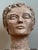 Exuding an air of quiet contemplation, this vintage plaster head sculpture is a striking example of Mid-Century artistic...