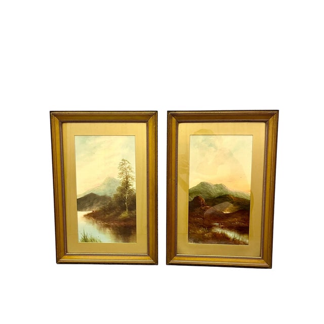 Add timeless charm to your walls with this pair of vintage landscape oil on board paintings, beautifully presented in...