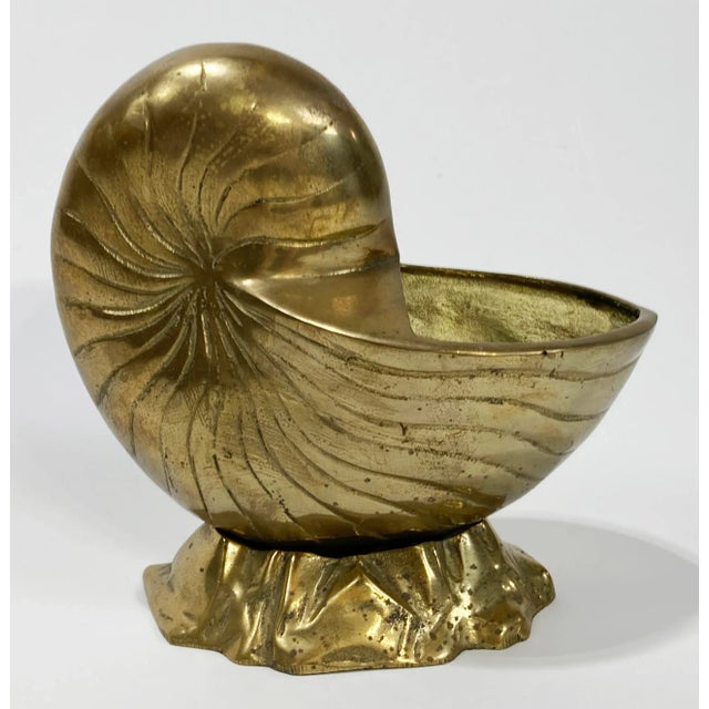 Heavy vintage nautilus style brass seashell planter atop faux rock stand. Use as a planter, pot, or as stand alone decor...