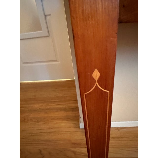 Classically elegant late 18th century cherry Hepplewhite style sideboard having curved bow front shapely front and three...