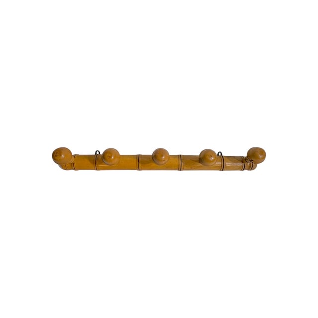 Charming and practical, this antique French Provincial wall rack features a classic faux bamboo design with five rounded...