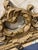 Vintage ornate wood mirror in gold. This is very heavy and has hanging material installed. It is from an estate and in...