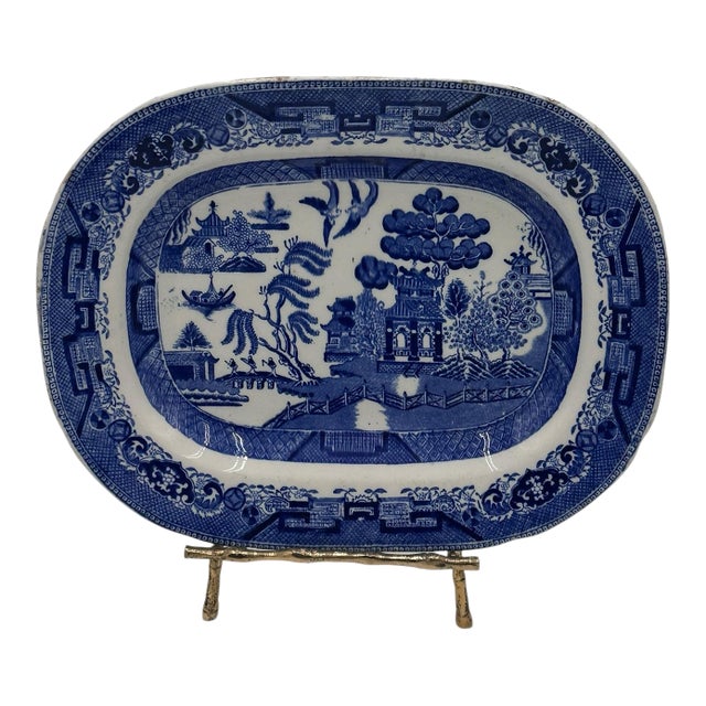 A classic Blue Willow platter, produced by Ridgway, one of England’s most prolific potteries of the 19th century, known...