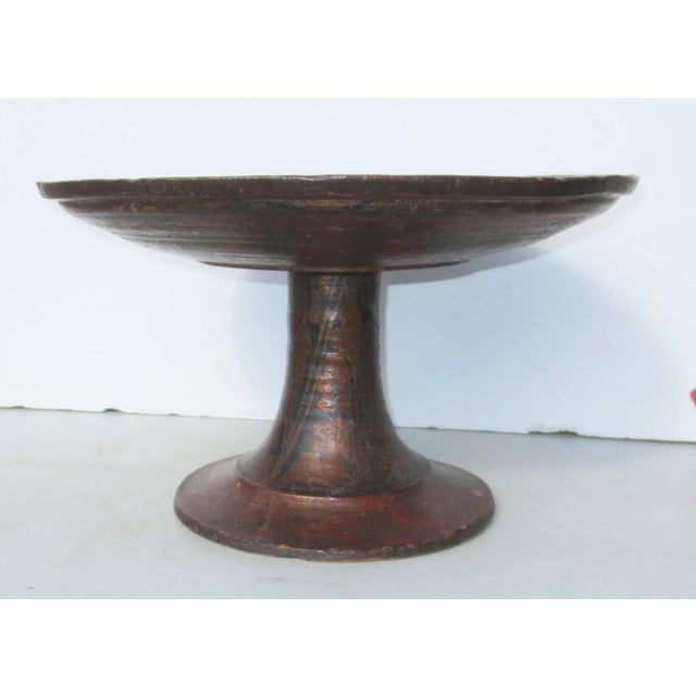 Centerpiece with red and gold traditional designs on the underside and stem of the plateau. Turned in hardwood, likely...