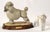 Whimsical, detailed porcelain figurine of a poodle by G. Armani, displayed on a wooden base with a plaque bearing the...