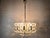Beautiful 2-layered mid-century chandelier made of patinated metal and crystal glass by hillebrand. The chandelier has 6x...