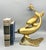 Charming and bright double dolphin figure made of brass. Mid-late 20th century Hollywood Regency piece. Features two...