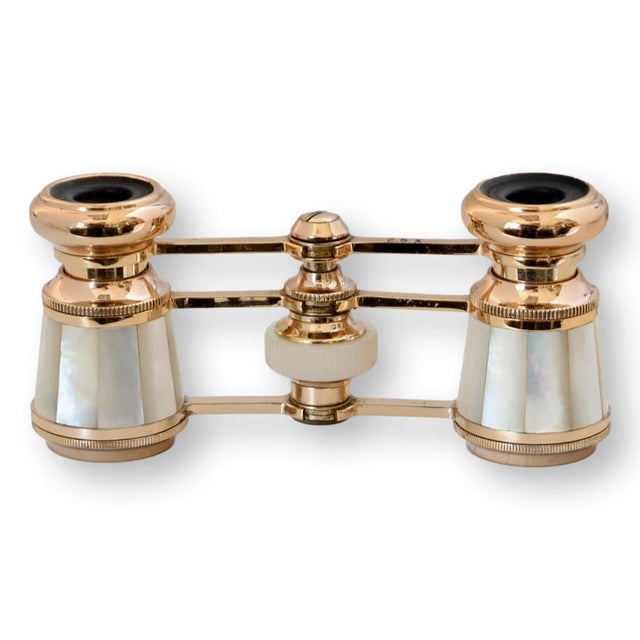 These midcentury opera glasses feature polished brass construction with pearlized panels and a classic, elegant...