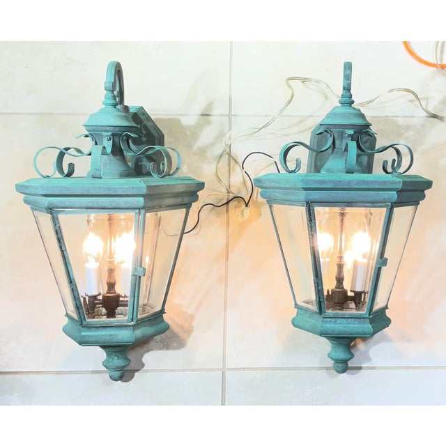 exceptional pair of solid brass wall lanterns. substantial, high-quality architectural pieces featuring a timeless...