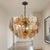 There are pieces that illuminate a room, and then there are pieces that transform it entirely. This extraordinary...