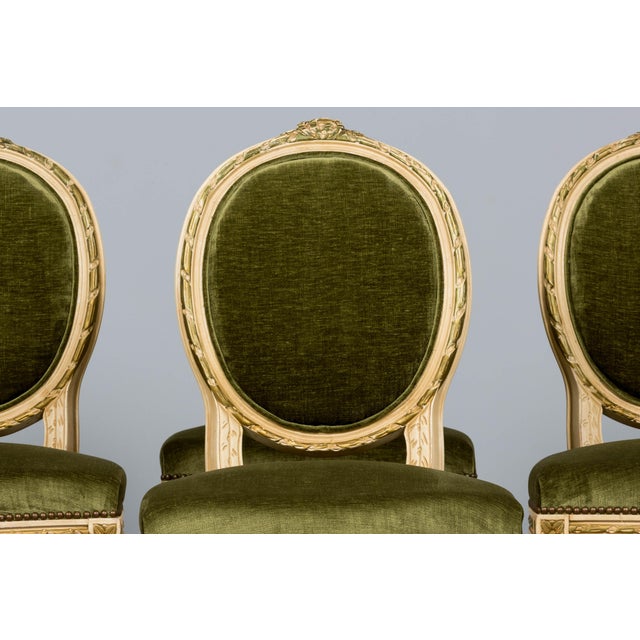 An exquisite set of eight early 20th-century French Louis XVI style dining chairs, sourced in Provence, France. The frames...