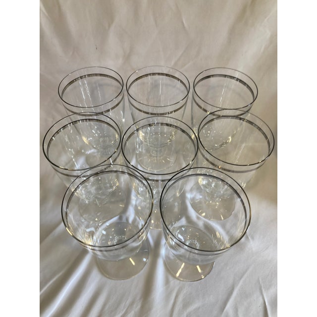 This elegant set of 8 Fostoria Reflection glasses features a refined platinum rim and timeless curved silhouette. The...
