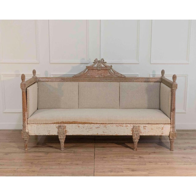 A fine period Gustavian sofa dating to circa 1780, retaining its original painted surface, carefully scraped back to...