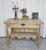 This early 19th-century American Arts & Crafts library table features quartersawn oak construction and intricate carved...