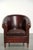 This rugged vintage sheepskin club chair features beautiful brown and red tones and has a luxurious finish with decorative...