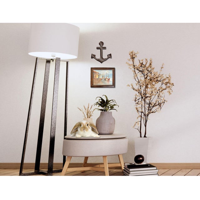 A vibrant French oil painting capturing a lively harbor scene with colorful boats docked along rustic buildings. The...