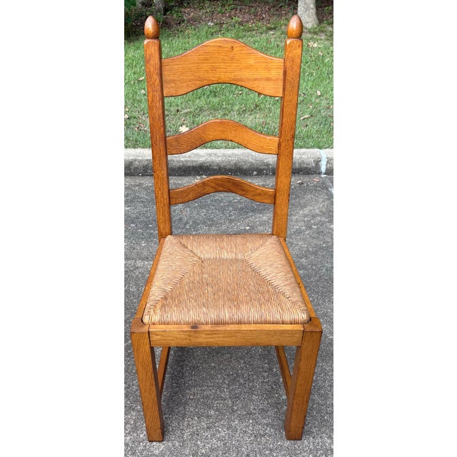 Very nice set of 8 French country ladder back dining chairs with rush seats.