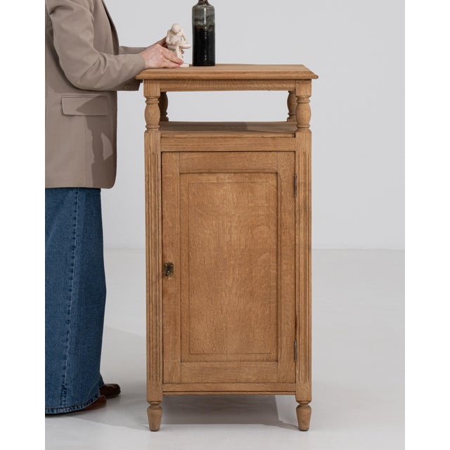 A functional 19th century oak workshop cabinet, originally used in ateliers or studios. The simple and sturdy construction...