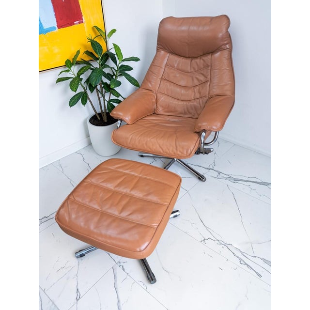 Mid century tan leather lounge chair on chrome swivel base with matching footstool - skoghaug industri as - in superb...