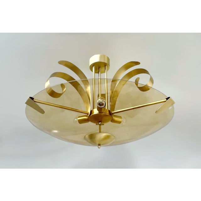 Italian modern art deco style chandelier with a smoked amber curved glass shade with a beveled edge, mounted on solid...