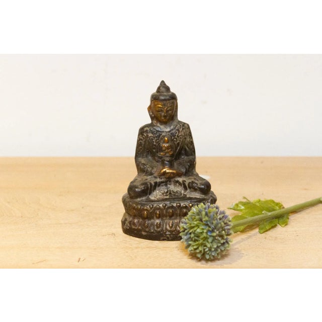 Small vintage repoussé metal Buddha sculpture, a harmonious blend of metal and wood craftsmanship. This exquisite Buddha...
