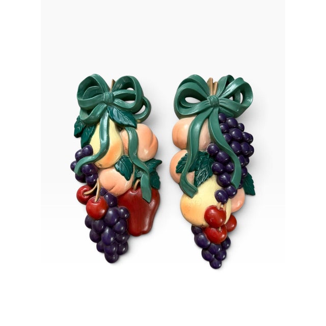 Vintage 1995 Burwood Products Co. set of two dimensional fruit wall plaques, featuring colorful clusters of grapes,...