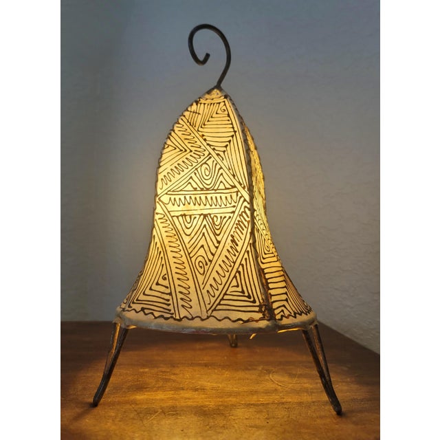 A radiant piece of Moroccan artistry, this handmade henna lamp brings the warmth of the Maghreb into any space. Crafted by...