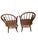 A handsome pair of vintage Windsor-style armchairs featuring gracefully curved bow backs, elongated paddle-form spindles,...