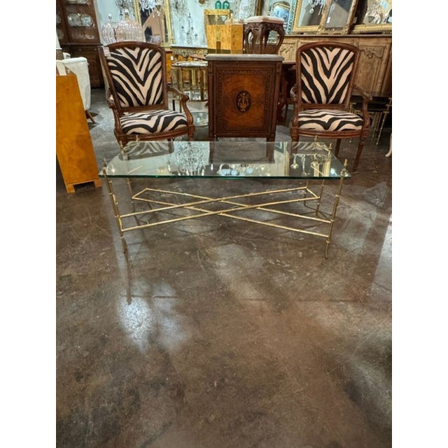 The Italian Brass Bamboo Form Coffee Table is a stylish and elegant piece of furniture . The combination of brass and...