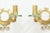 Exceptional pair of French wall sconces dating from circa 1940, finely crafted in gilt bronze and glass, each centred by a...