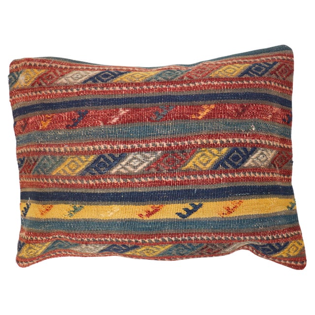 Pillow made from a vintage Turkish Kilim with cotton back. Zipper closure and foam insert provided. Measures: 16'' x 21''.
