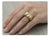 14k Yellow gold satin finished ring with 8 baguette-cut diamonds weighing approximately 0.60 carats. Size 6.5 (sizable)...