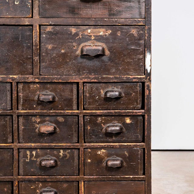 1940's tall french workshop shelving unit - thirty four drawers. Sourced in france this is a practical piece of storage,...