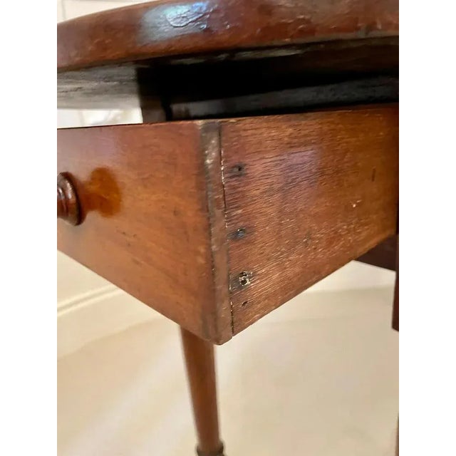 Unusual antique victorian side table having an unusual solid walnut shaped top above an end frieze drawer standing on four...