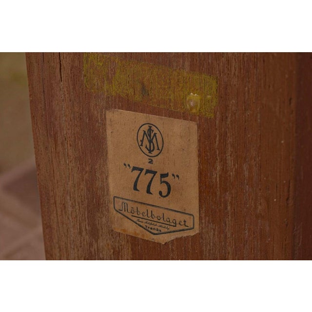 A distinctive wedge-form teak side table produced by Möbelbolaget Tranås in Sweden during the 1950s, its angular...