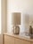 ⁠Charming contemporary accent table lamp featuring a sculptural, high-gloss white ceramic base with an elegant scalloped /...