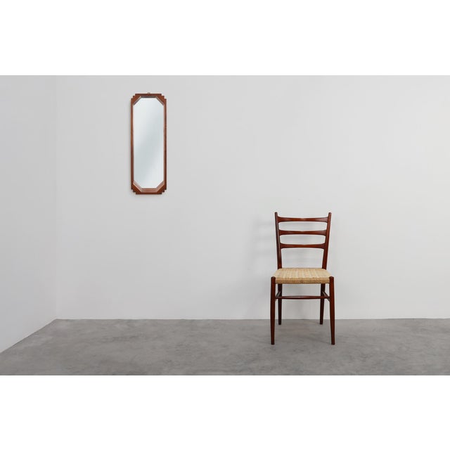 A striking example of early Italian Art Deco design, this geometric wooden mirror from around 1925 embodies the movement’s...