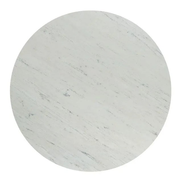 A round stone top rests over a cast metal tapering central column and base in a gunmetal finish.