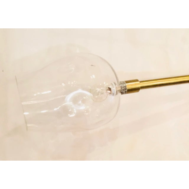 Original Retail $2500, stylish John Richard Modern Brass Finished Glass Globe Chandelier, showroom floor sample