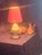 Charming vintage white ceramic table lamp featuring a classic crackle-glaze finish and traditional urn silhouette. The...