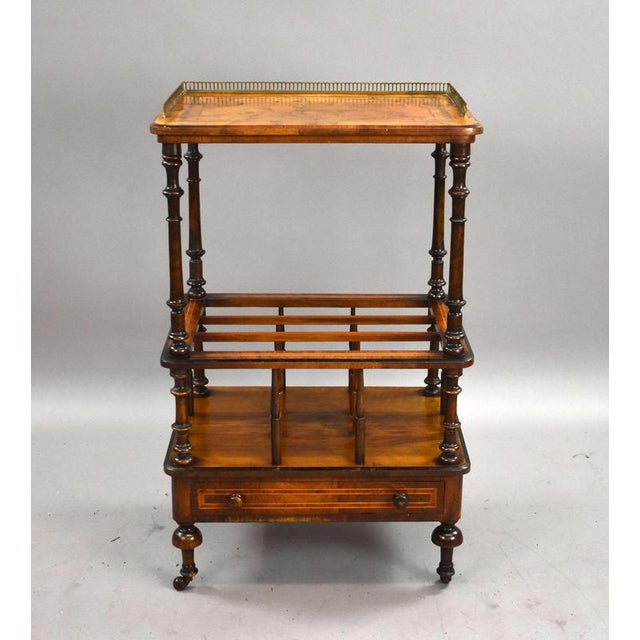 A fine quality Victorian burr walnut Canterbury, raised on original turned supports with a shaped upper tier and...