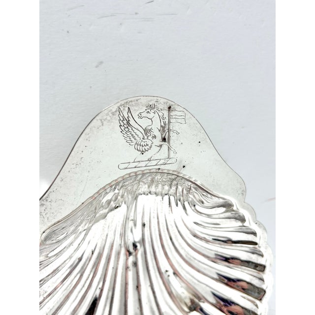 This elegant vintage silverplate dish is modeled in the form of a classical scallop shell, a motif long associated with...