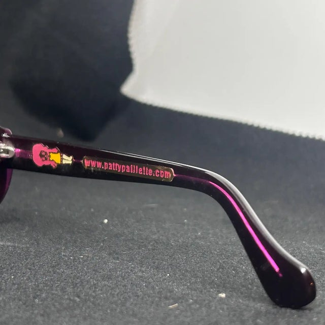 These are a pair of Retro Purple and White Italian Oversize Sunglasses by Patty Paillette, a designer known for her...